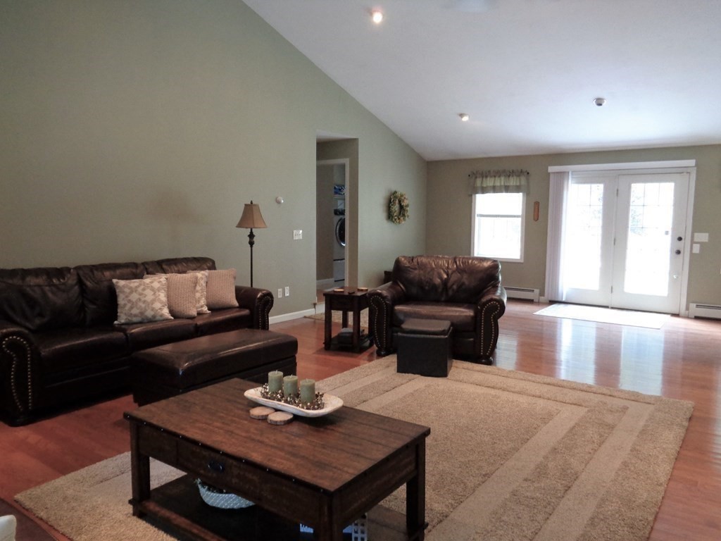 7 R Oxbow Road Oxford, MA 01537 - Photo 18 of 40 a living room with furniture and wooden floor