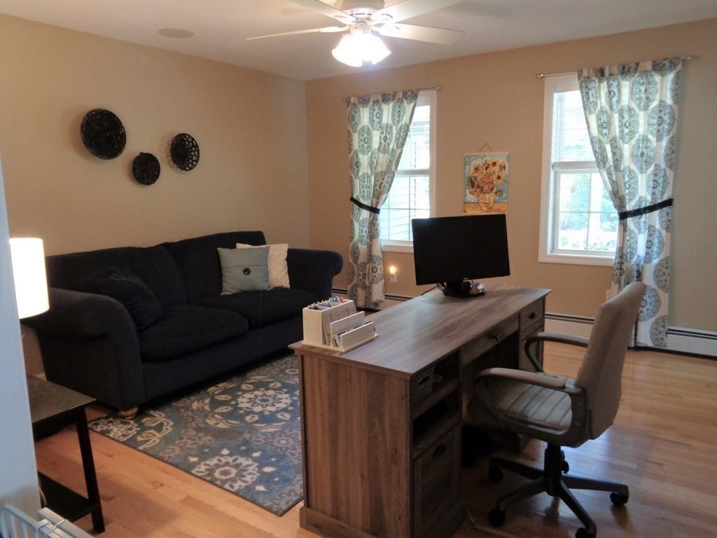 7 R Oxbow Road Oxford, MA 01537 - Photo 21 of 40 a view of a livingroom with workspace and a window