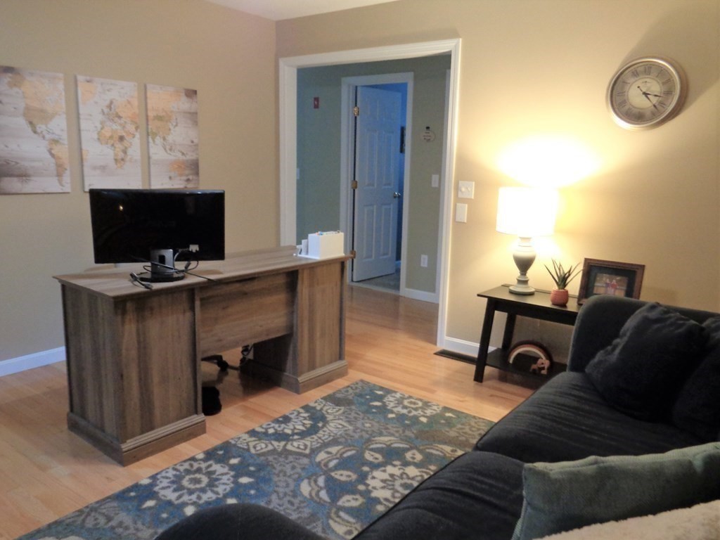 7 R Oxbow Road Oxford, MA 01537 - Photo 22 of 40 a livingroom with workspace and a couch