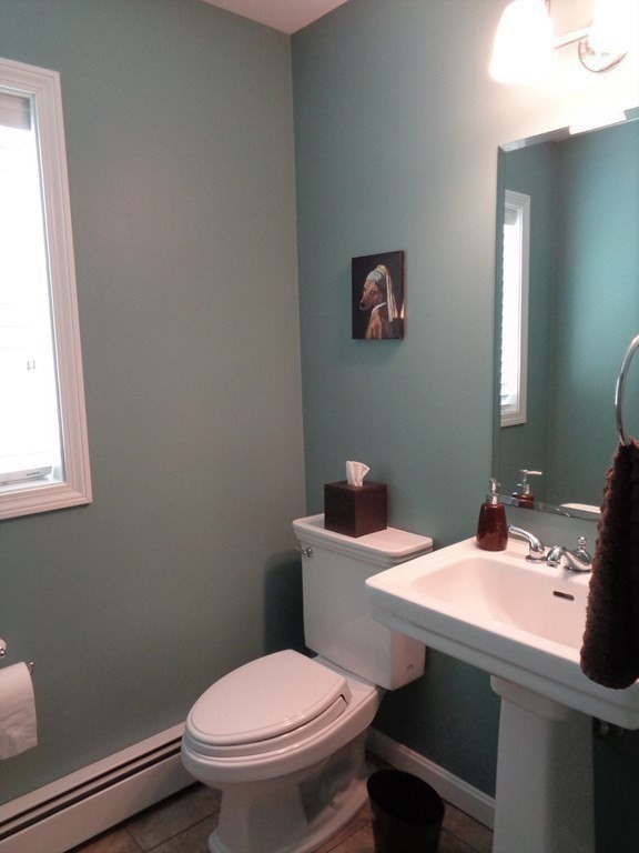 7 R Oxbow Road Oxford, MA 01537 - Photo 23 of 40 a bathroom with a sink mirror and toilet