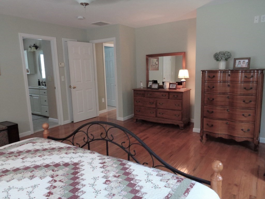 7 R Oxbow Road Oxford, MA 01537 - Photo 26 of 40 a bed room with a bed and dresser