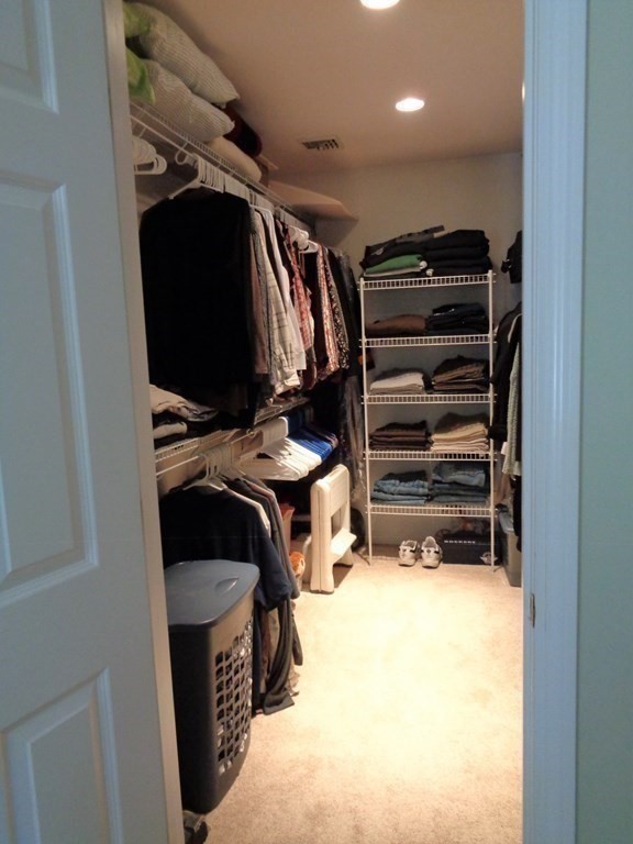 7 R Oxbow Road Oxford, MA 01537 - Photo 27 of 40 a view of walk in closet with clothes and shoes