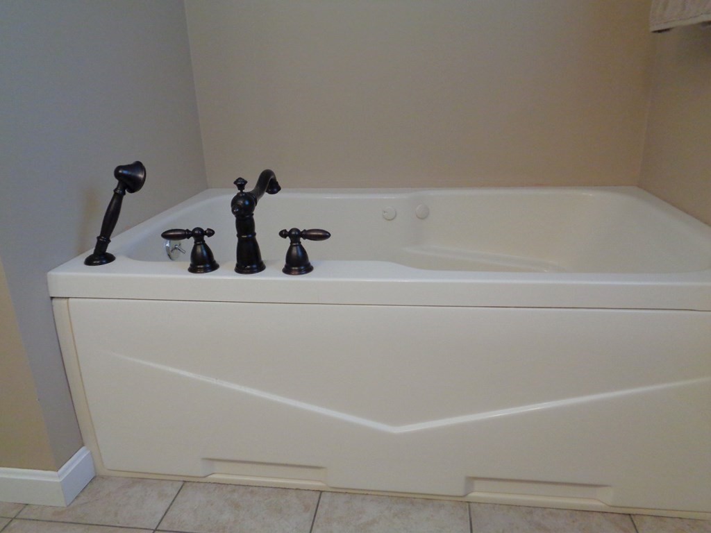 7 R Oxbow Road Oxford, MA 01537 - Photo 30 of 40 a bathroom with a bathtub
