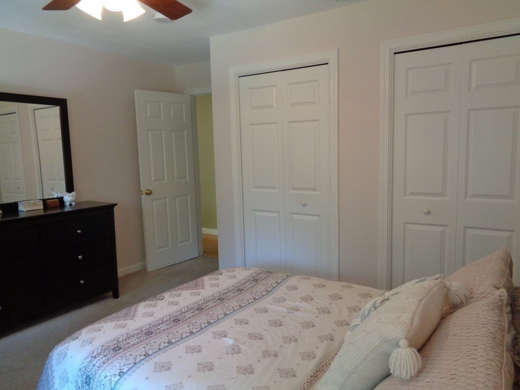 7 R Oxbow Road Oxford, MA 01537 - Photo 32 of 40 a bedroom with a bed and a dresser