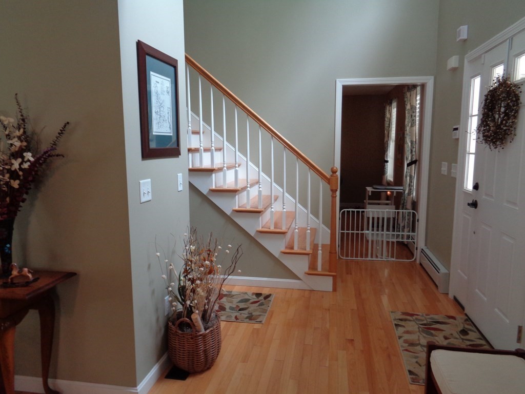 7 R Oxbow Road Oxford, MA 01537 - Photo 7 of 40 a view of entryway and hall with wooden floor