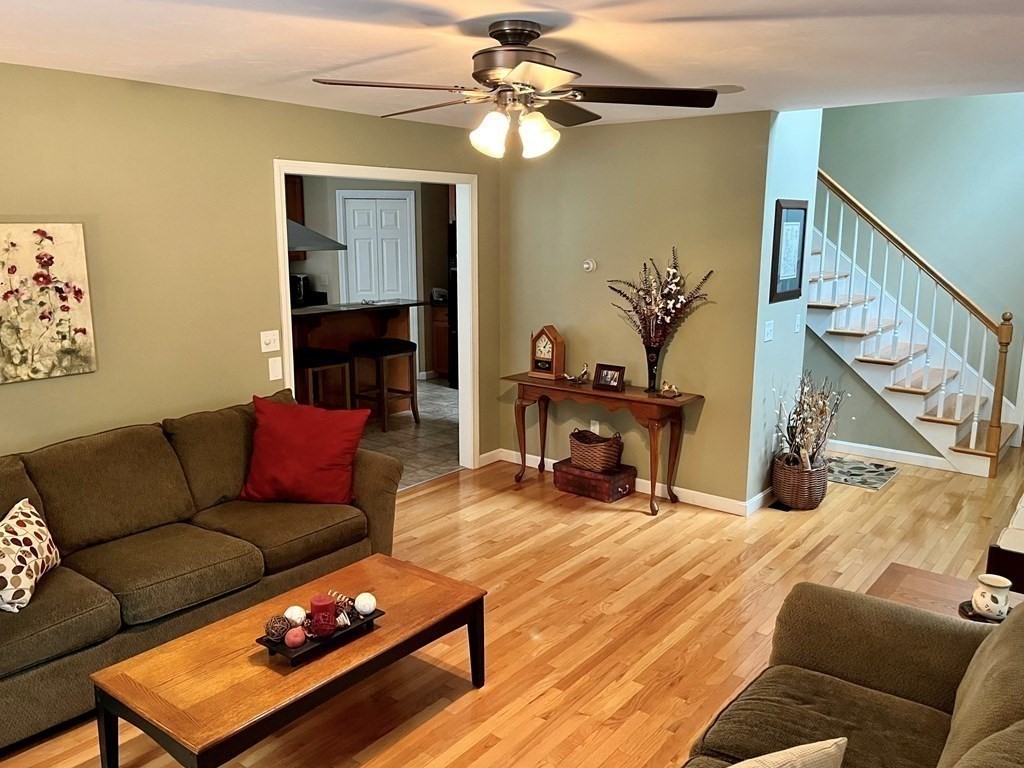 7 R Oxbow Road Oxford, MA 01537 - Photo 10 of 40 a living room with furniture and a chandelier