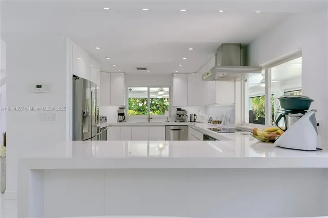 a bathroom with a sink mirror and toilet