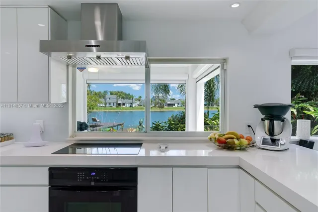 a bathroom with a toilet a sink a mirror and shower