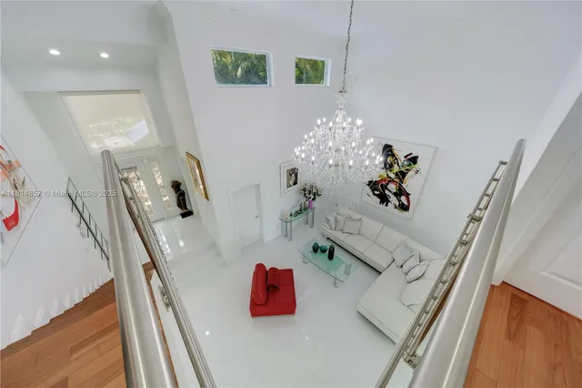 a view of a bird house with a small yard and plants