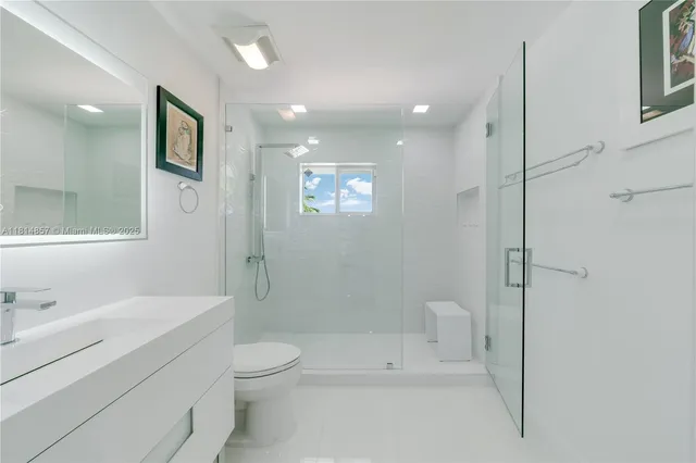 a view of a lake with a house in the background