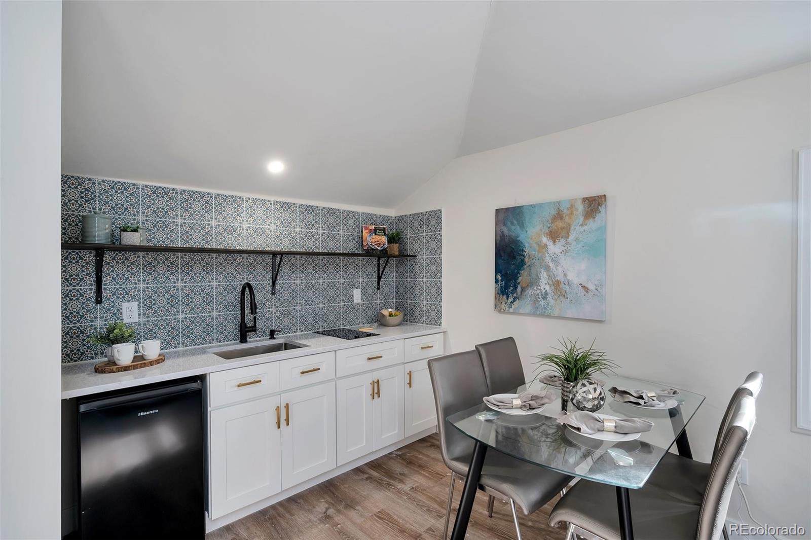 1417 Monroe Street Denver, CO 80206 - Photo 12 of 43 a kitchen with a sink cabinets and wooden floor