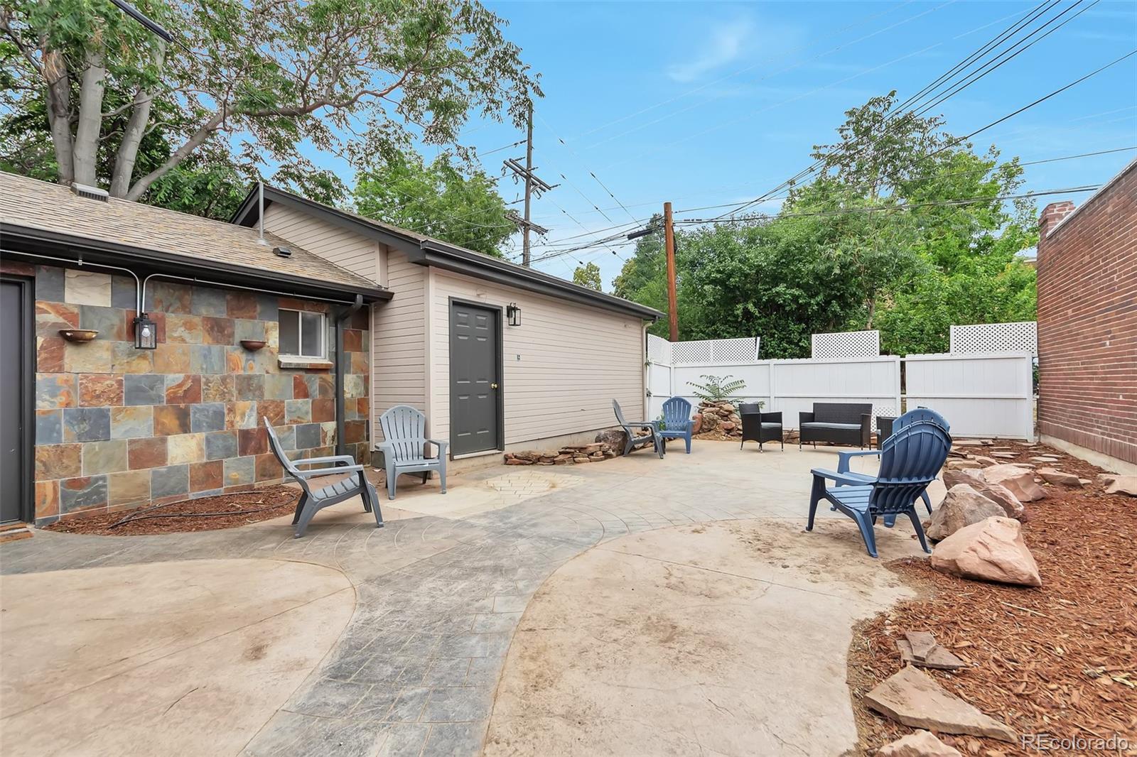 1417 Monroe Street Denver, CO 80206 - Photo 15 of 43 a view of a backyard with a sitting area
