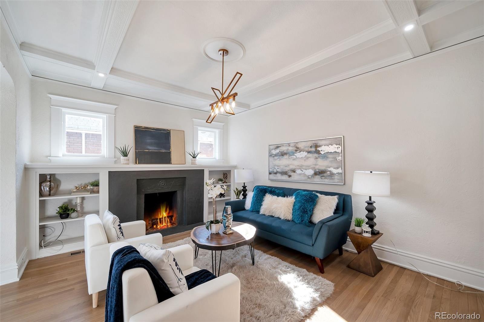 1417 Monroe Street Denver, CO 80206 - Photo 38 of 43 a living room with furniture and a fireplace
