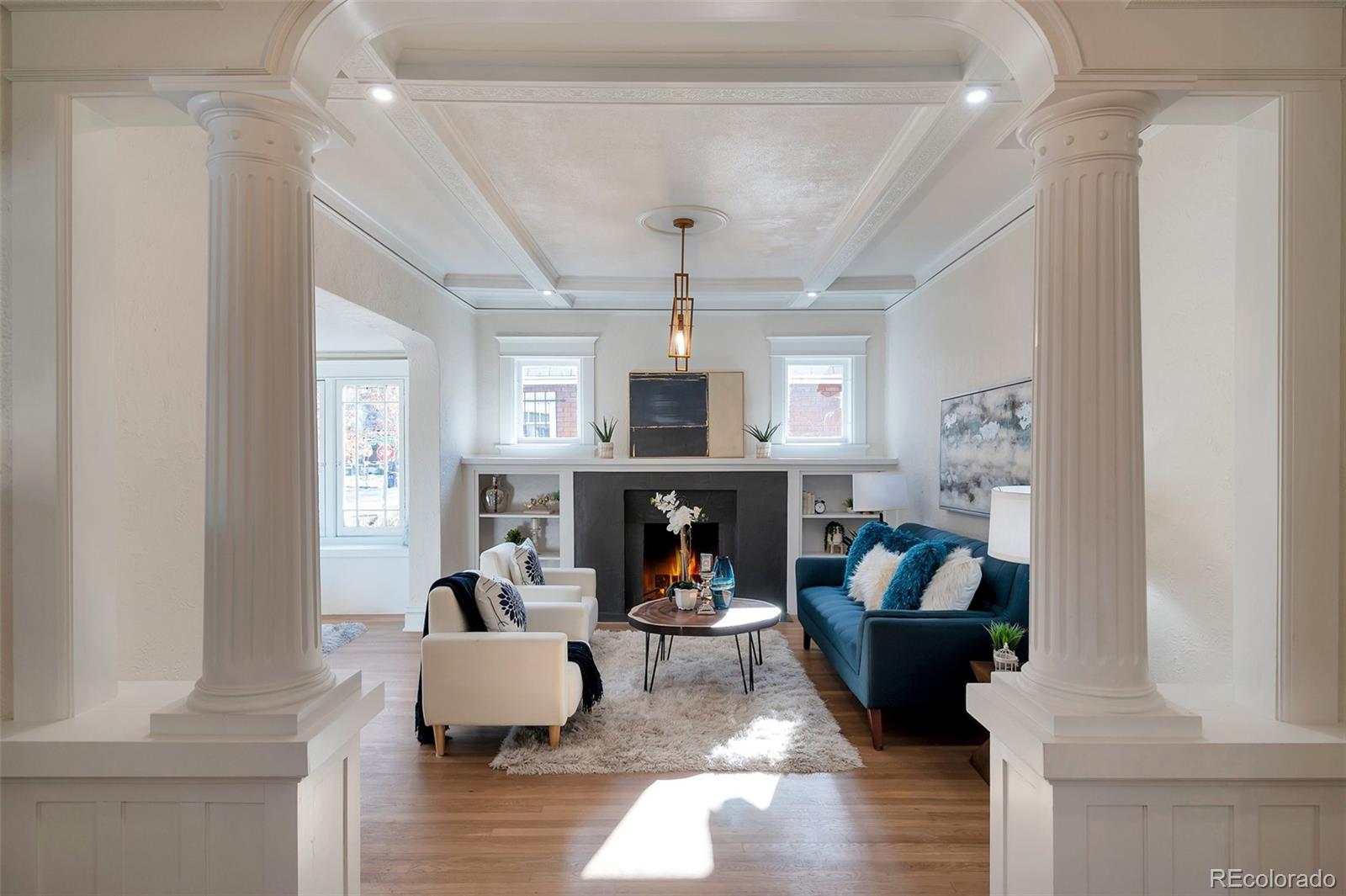 1417 Monroe Street Denver, CO 80206 - Photo 5 of 43 a living room with fireplace furniture and a fireplace