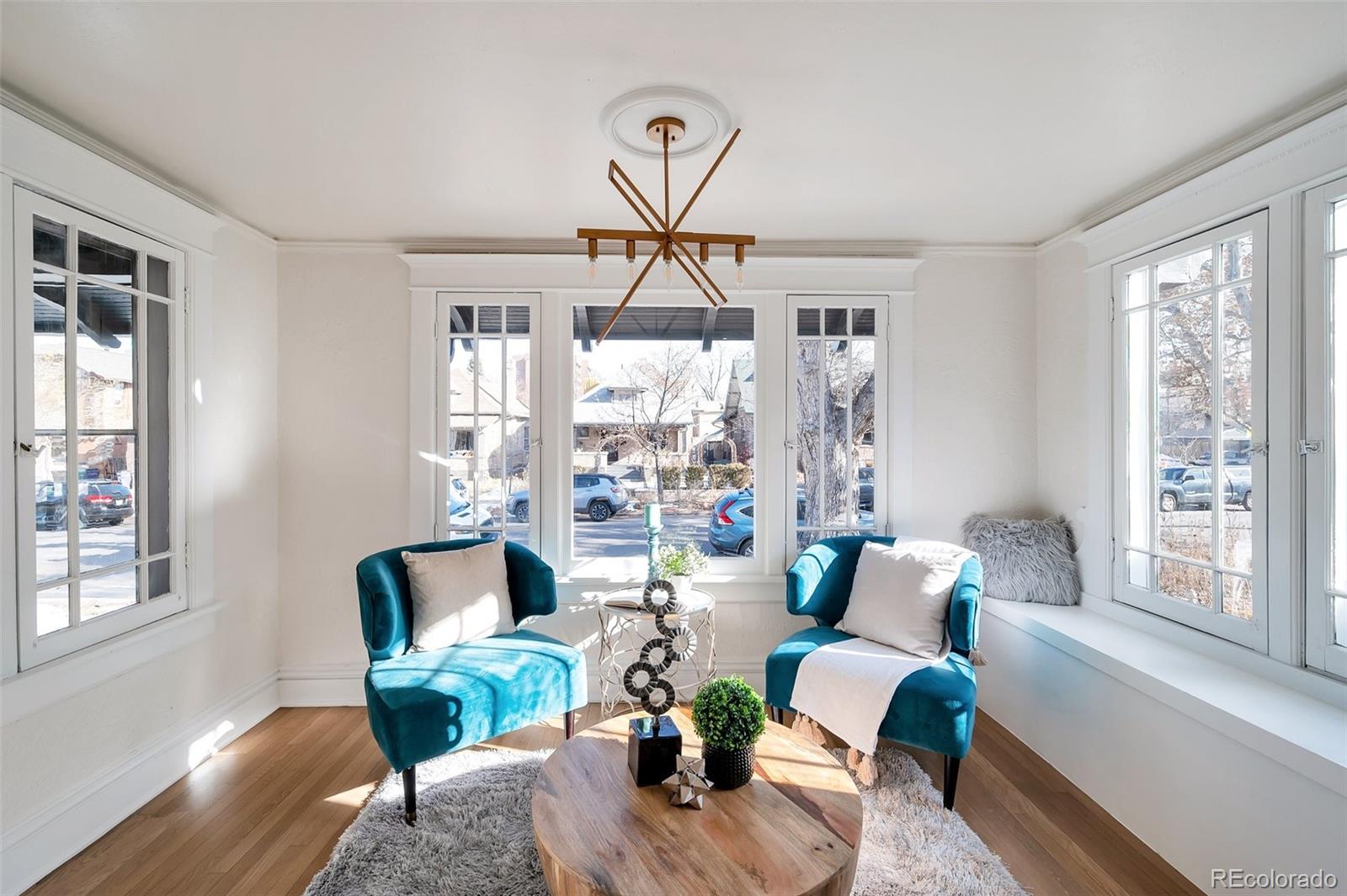 1417 Monroe Street Denver, CO 80206 - Photo 10 of 43 a living room with furniture and a window