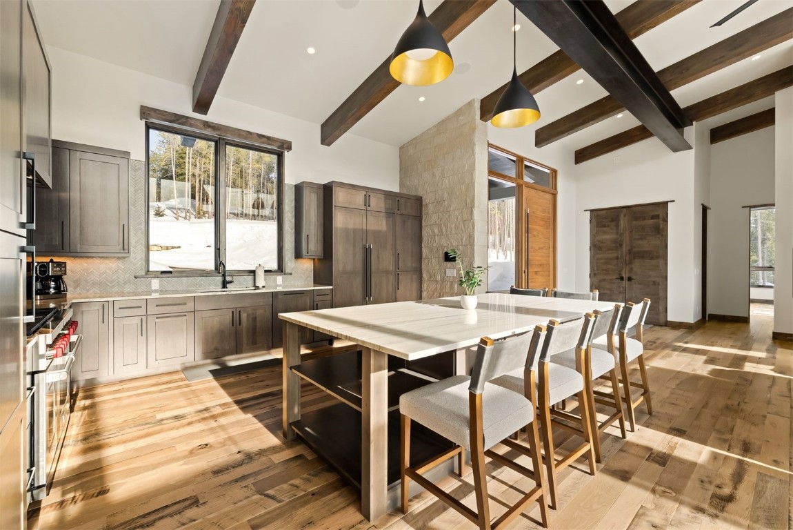67 Marys Ridge Lane Breckenridge, CO 80424 - Photo 11 of 35 a dining hall with stainless steel appliances kitchen island granite countertop a table chairs and a refrigerator