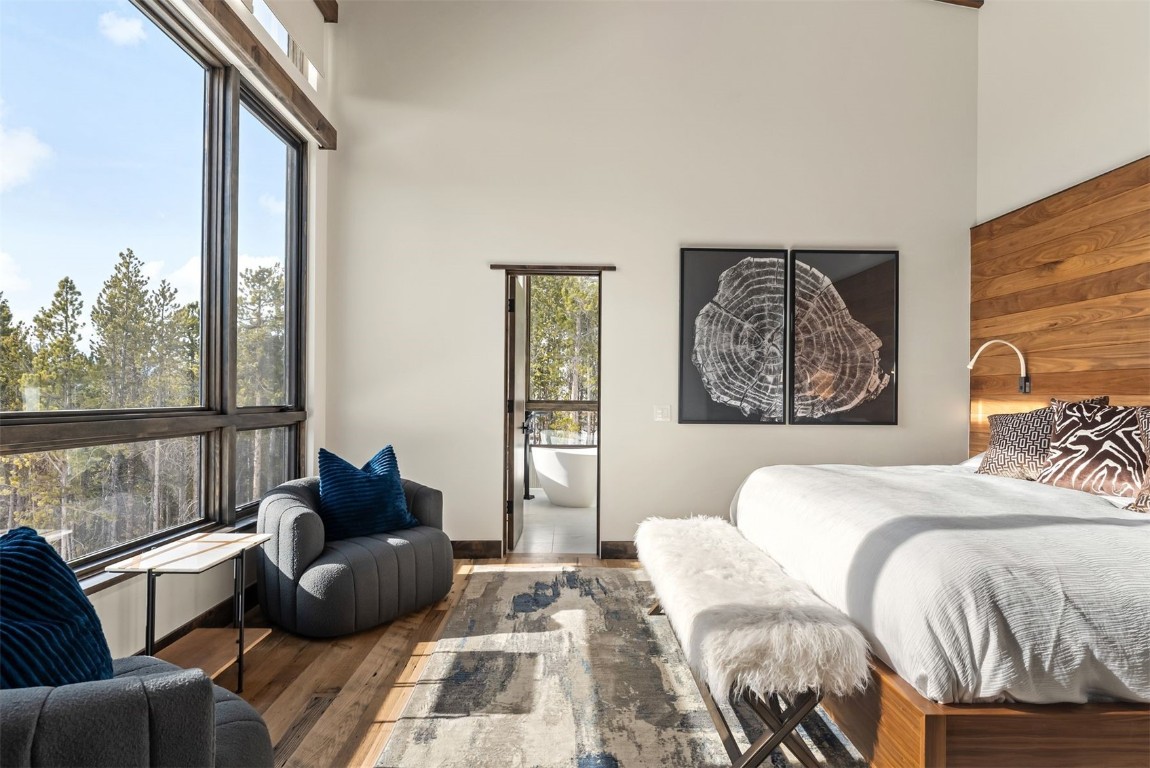 67 Marys Ridge Lane Breckenridge, CO 80424 - Photo 14 of 35 a bedroom with a bed and wooden floor