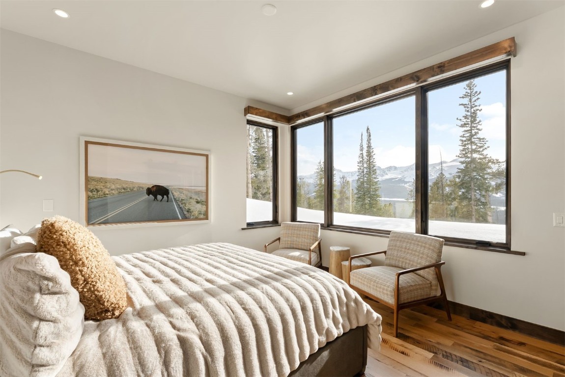 67 Marys Ridge Lane Breckenridge, CO 80424 - Photo 25 of 35 a bedroom with a bed and a painting on the wall