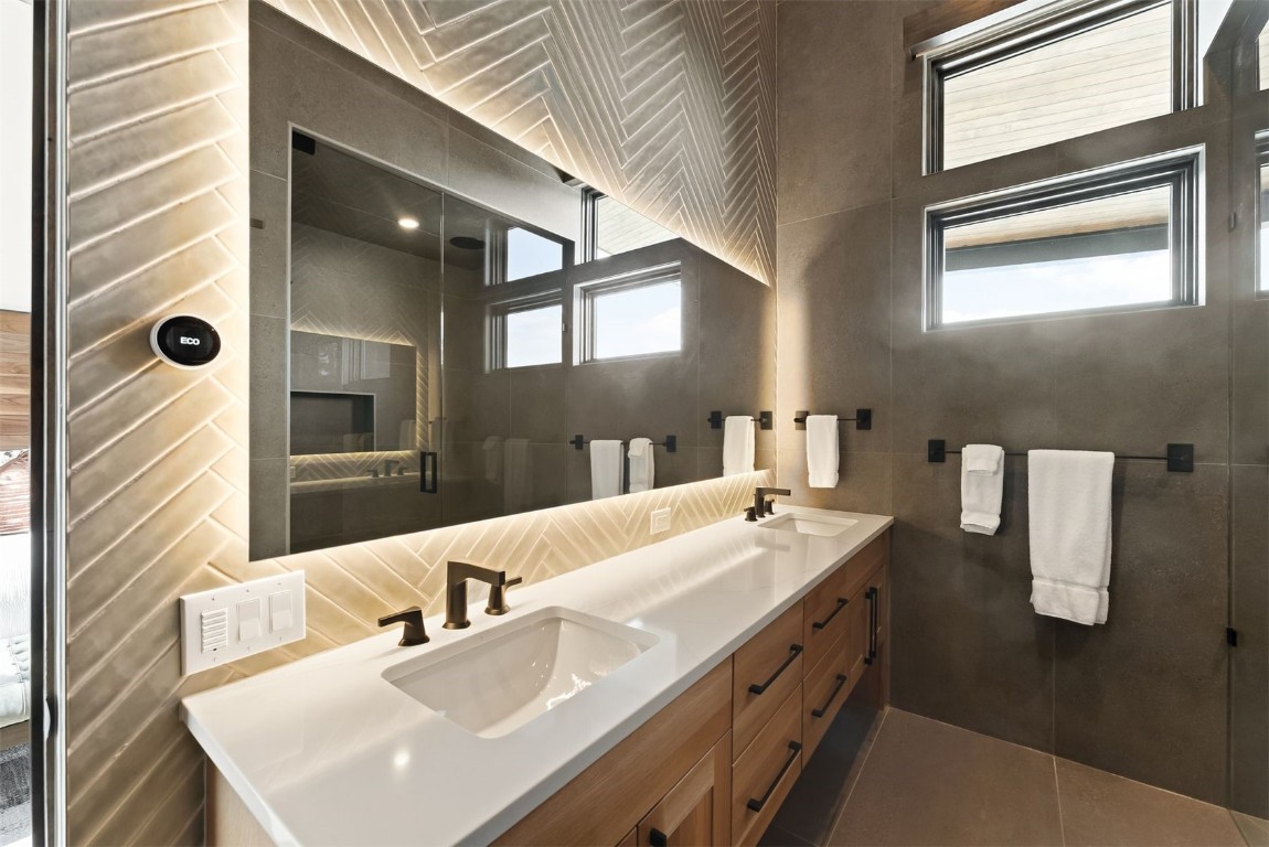 67 Marys Ridge Lane Breckenridge, CO 80424 - Photo 25 of 35 a spacious bathroom with a sink and a large mirror