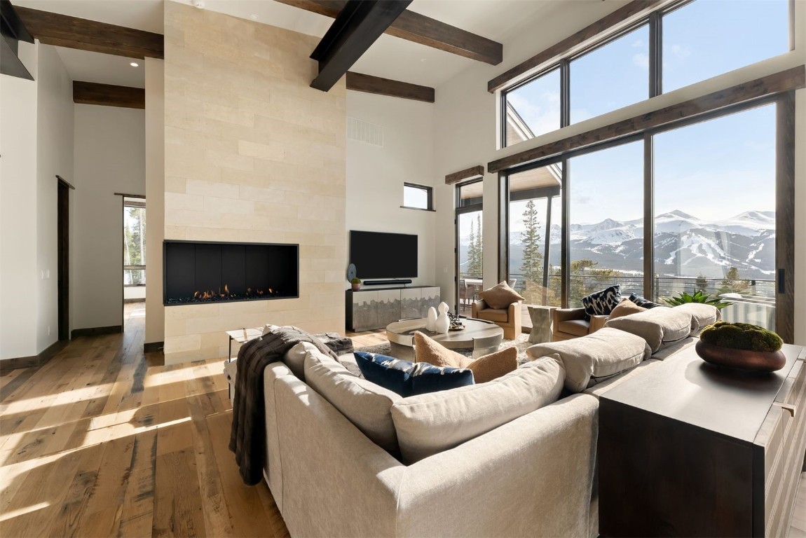 67 Marys Ridge Lane Breckenridge, CO 80424 - Photo 9 of 35 a living room with furniture a flat screen tv and a large window
