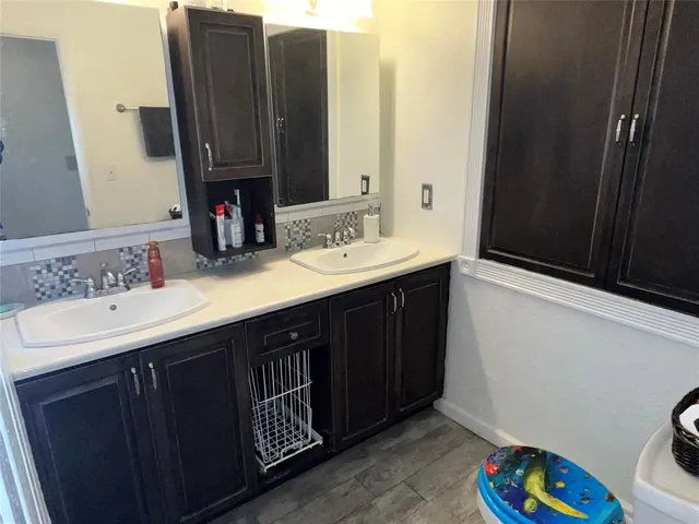 a bathroom with a sink and a mirror