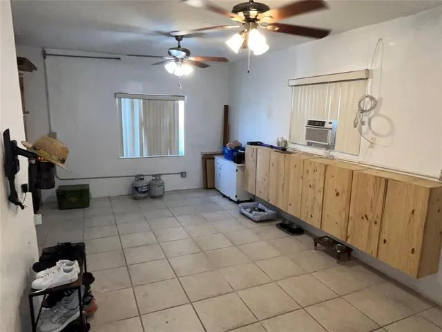 a kitchen with cabinets and window