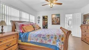 a bedroom with two beds and a dresser