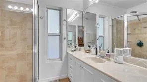 a bathroom with a double vanity sink mirror and double