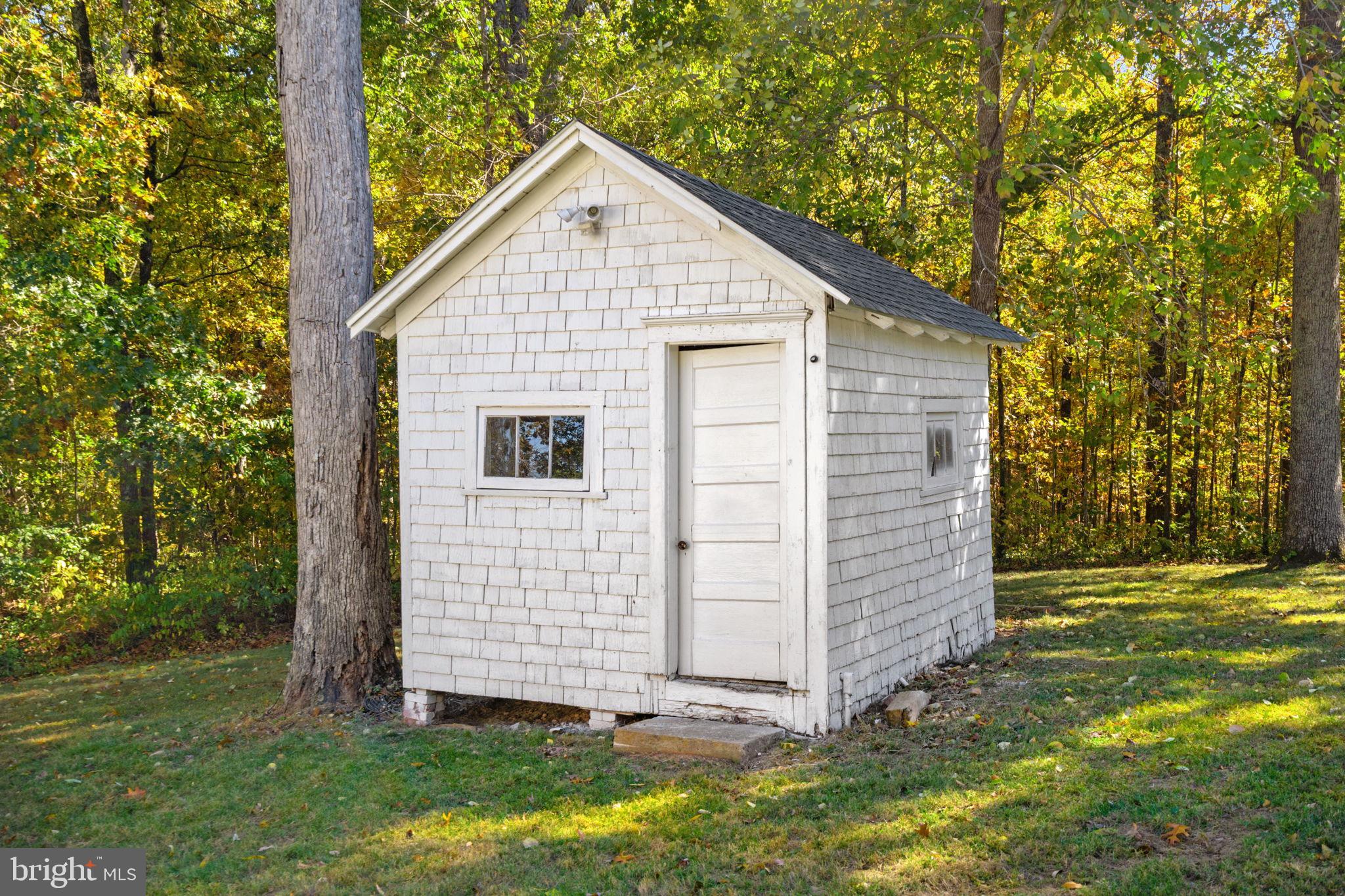4561 Weston Road Catlett, VA 20119 - Photo 49 of 59 Charming shed nestled in a serene forest.