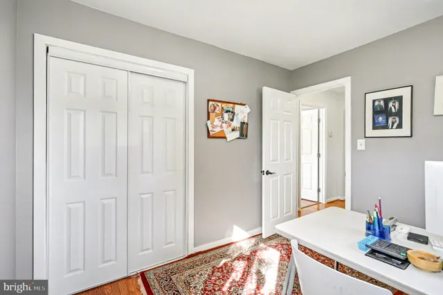a bedroom with a bed and cabinets