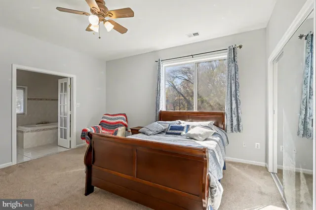 a bed room with a bed and window