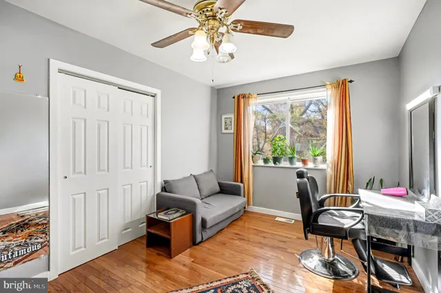 a living room with furniture a table and chair with garden view