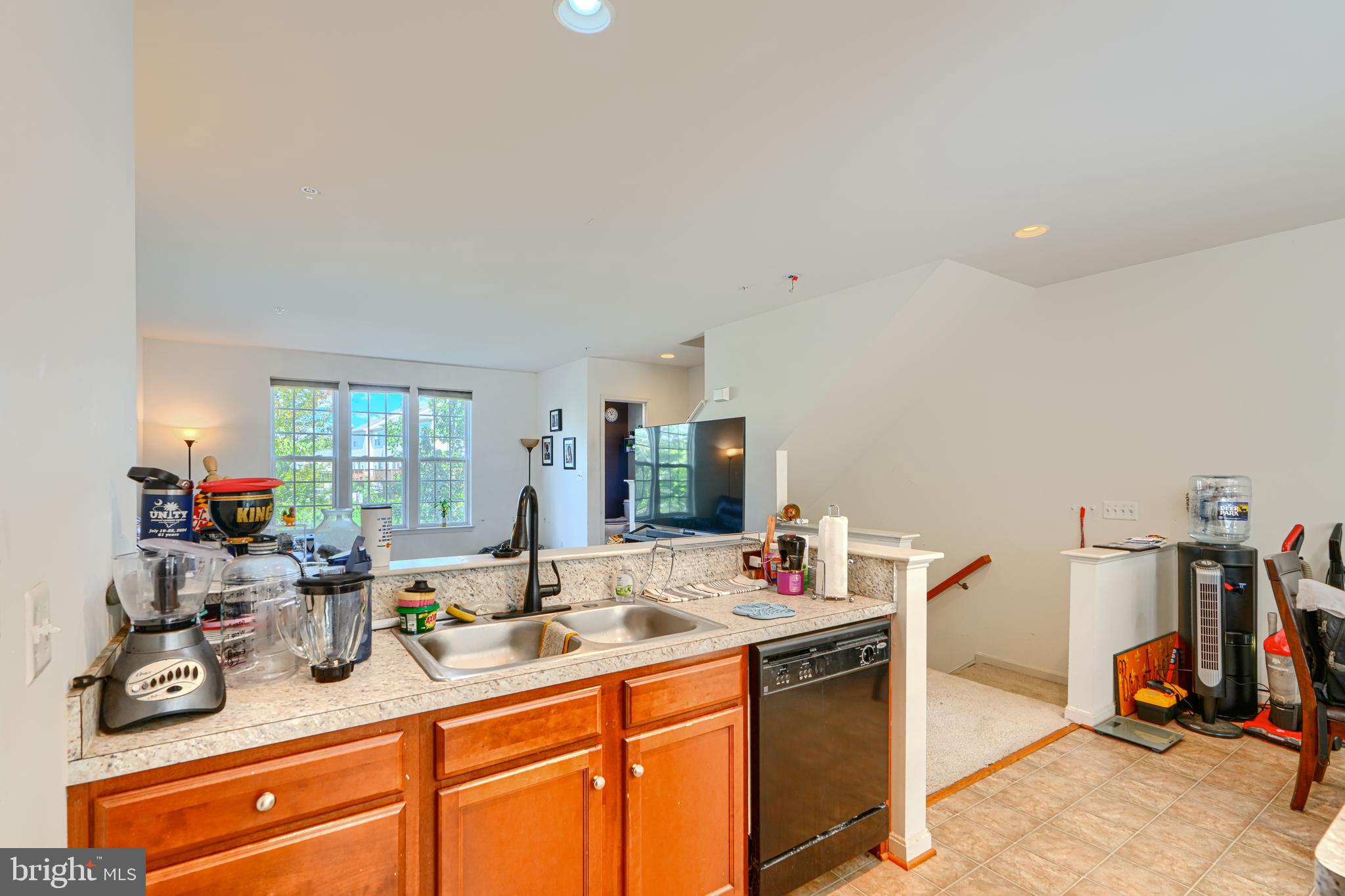 44317 Ocelot Way California, MD 20619 - Photo 23 of 45 a view of a kitchen with a sink and cabinets