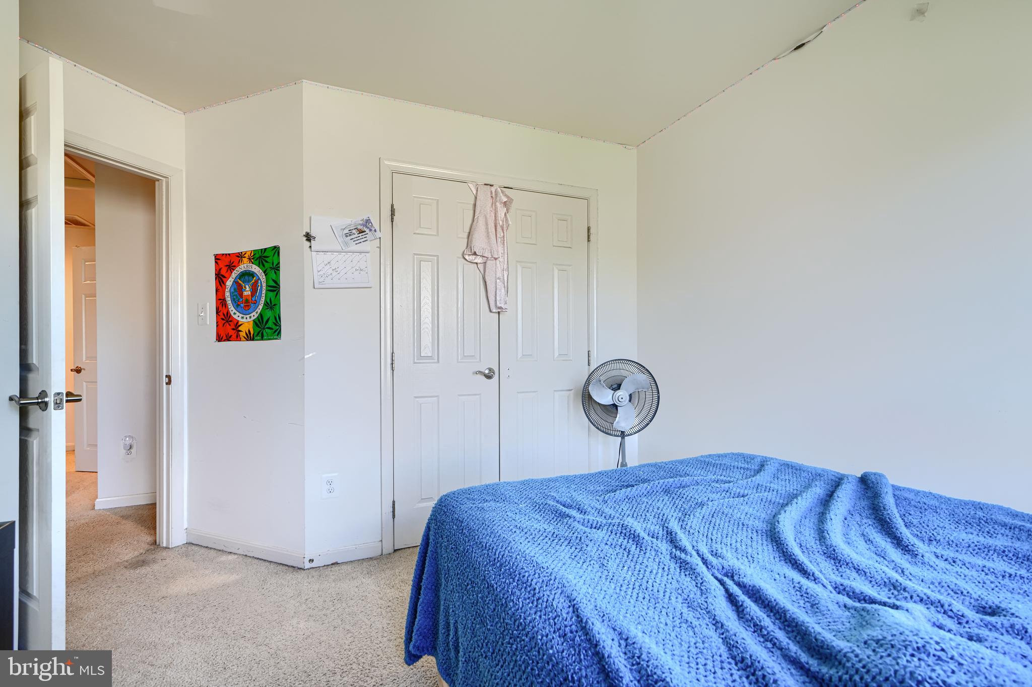 44317 Ocelot Way California, MD 20619 - Photo 29 of 45 a bedroom with a bed and a painting on the wall