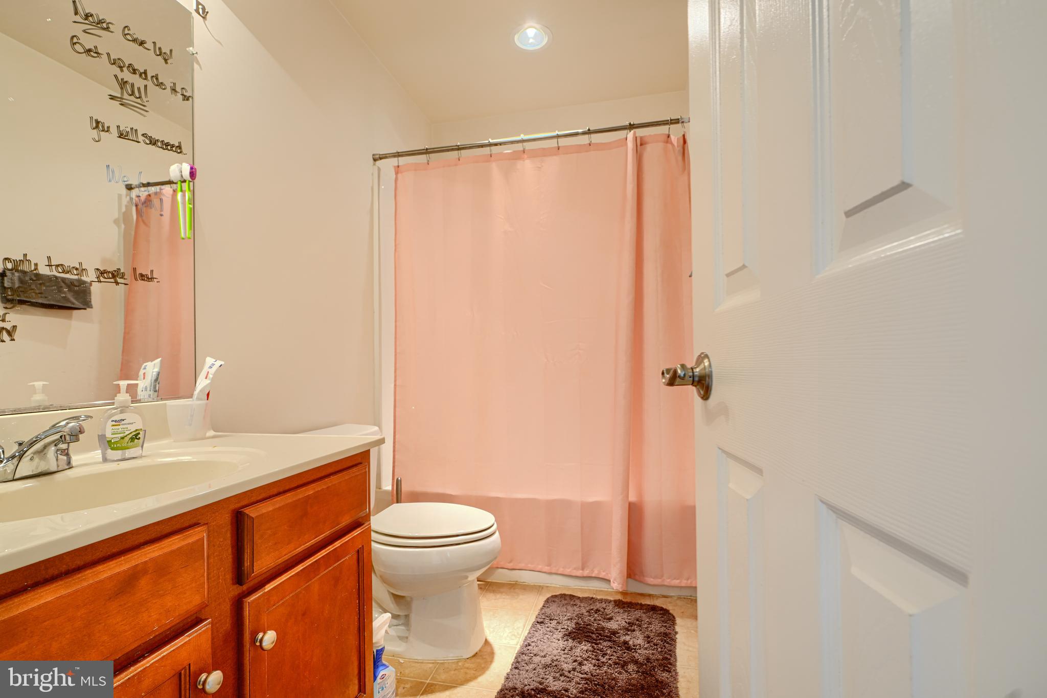 44317 Ocelot Way California, MD 20619 - Photo 32 of 45 a bathroom with a sink a toilet and shower