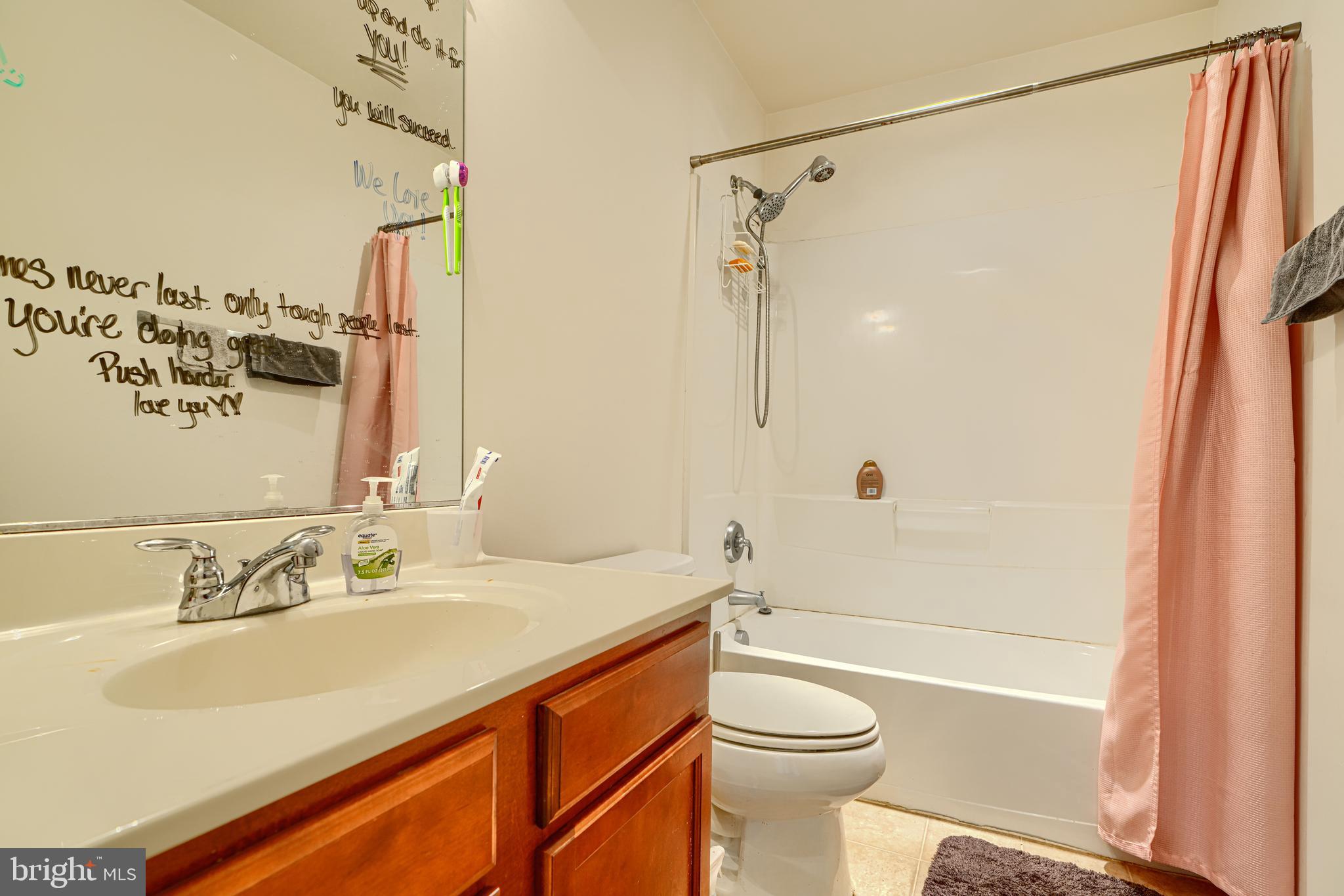 44317 Ocelot Way California, MD 20619 - Photo 34 of 45 a bathroom with a sink a toilet and shower