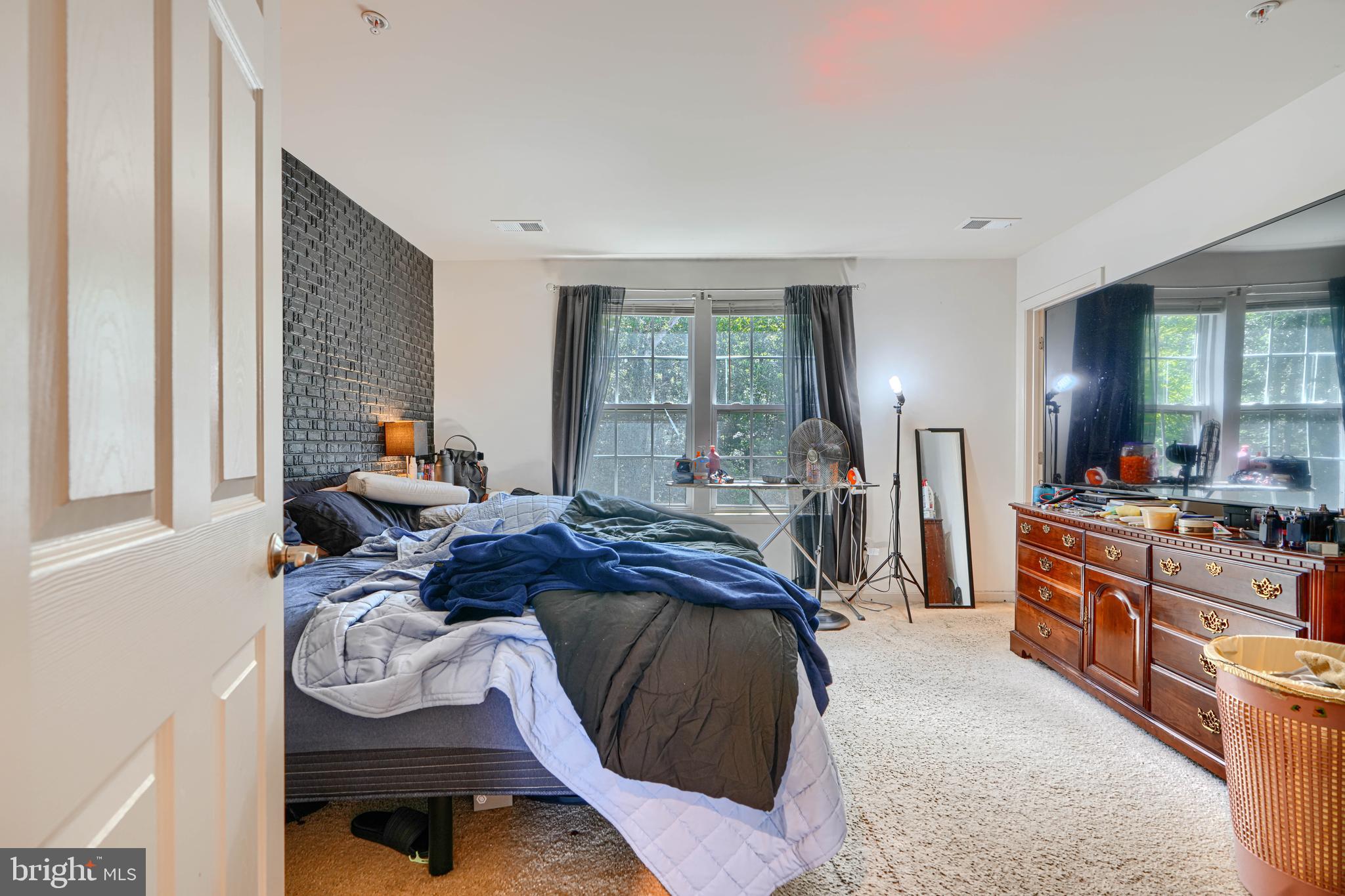 44317 Ocelot Way California, MD 20619 - Photo 38 of 45 a bed room with a bed and a mirror