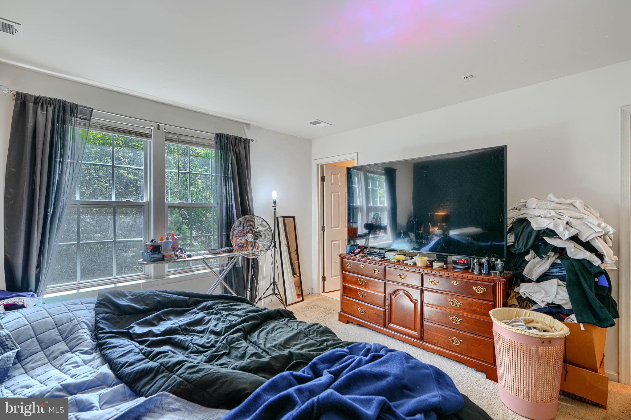 44317 Ocelot Way California, MD 20619 - Photo 39 of 45 a living room with furniture and a flat screen tv