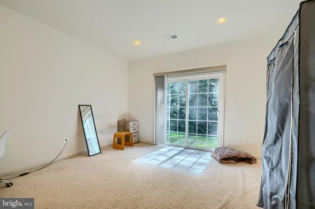 a bed room with a bed and a chair