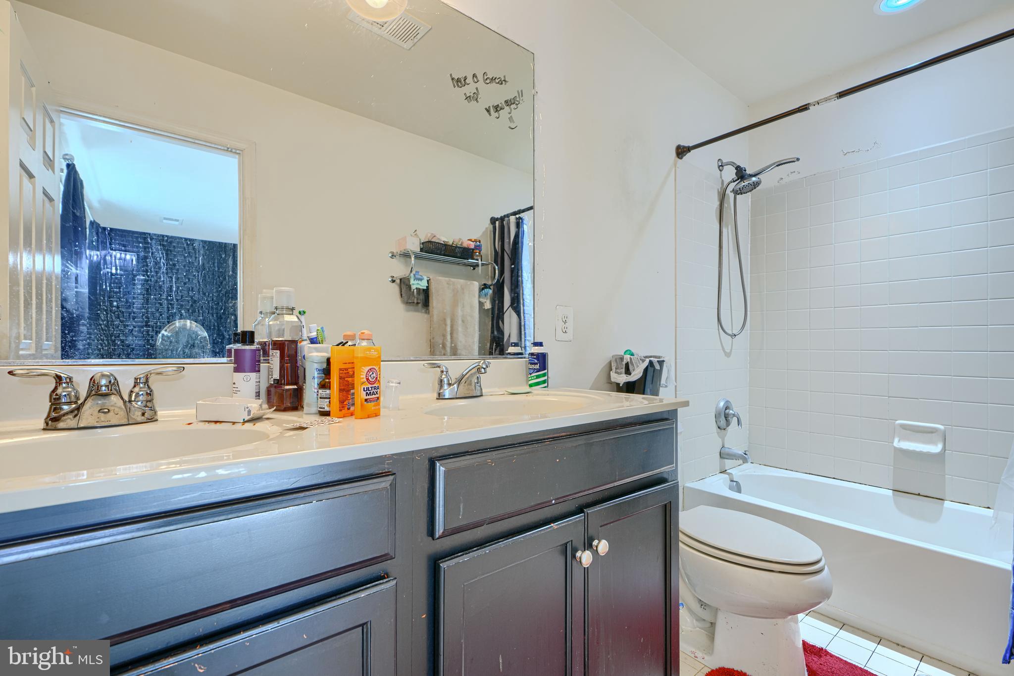44317 Ocelot Way California, MD 20619 - Photo 43 of 45 a bathroom with a sink toilet vanity and shower
