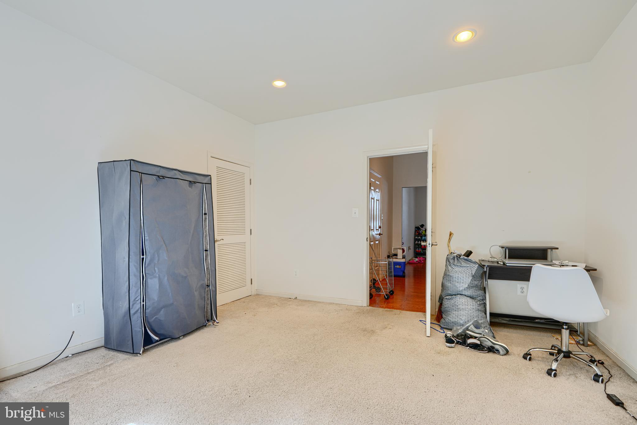 44317 Ocelot Way California, MD 20619 - Photo 5 of 45 a room with a mirror and gym equipment