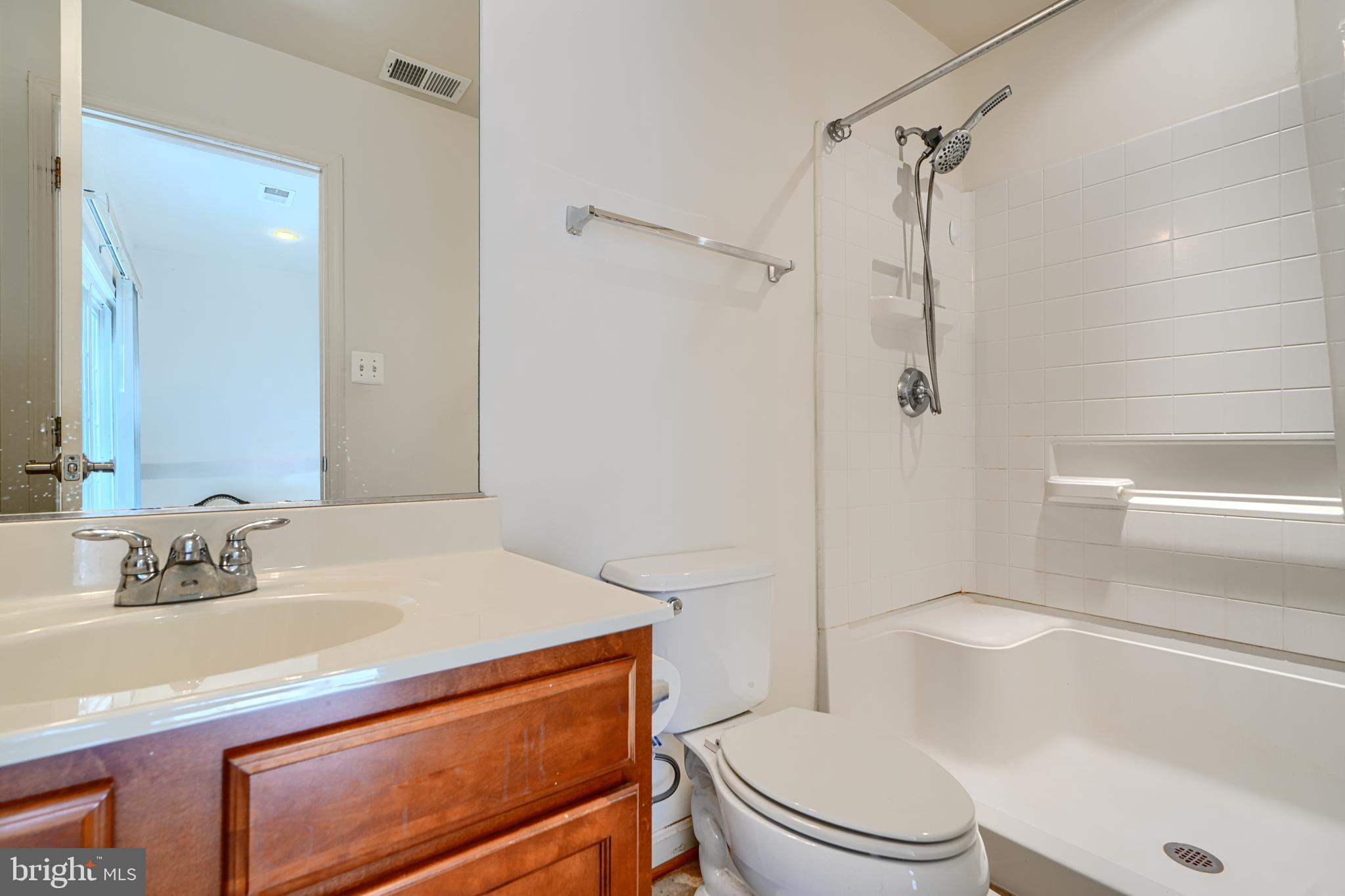 44317 Ocelot Way California, MD 20619 - Photo 8 of 45 a bathroom with a sink a toilet and shower