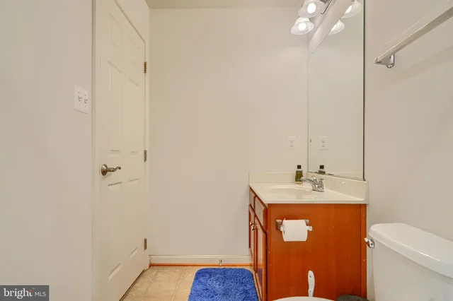 a bathroom with a sink toilet and vanity