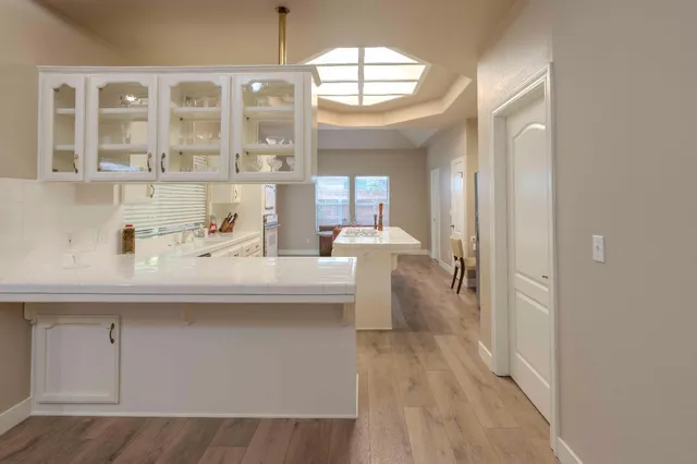 a bathroom with a sink a mirror and a shower