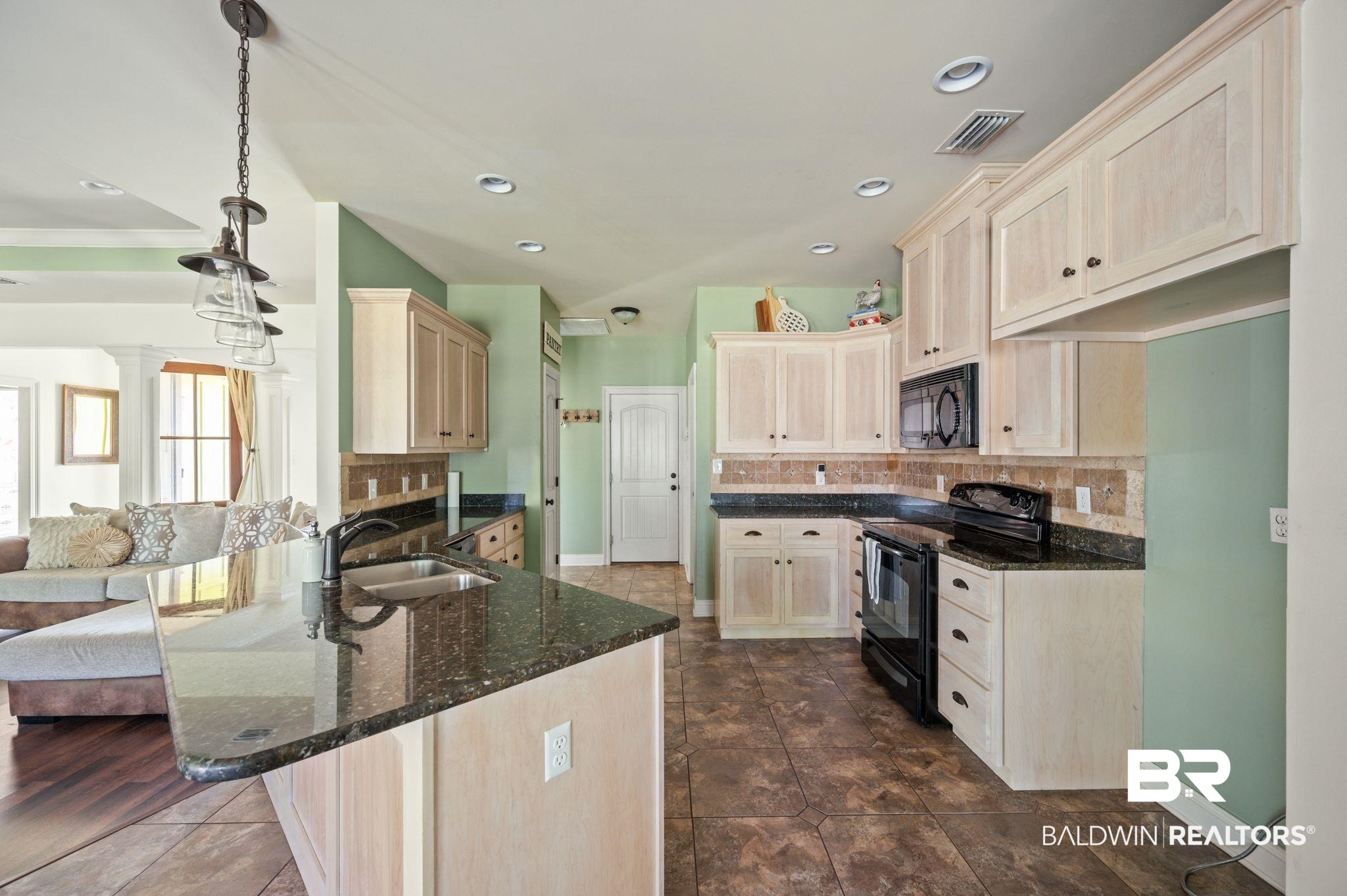 3879 Symphony Way West Semmes, AL 36575 - Photo 14 of 34 Kitchen featuring decorative backsplash, dark hardwood / wood-style floors, sink, black appliances, and dark stone counters