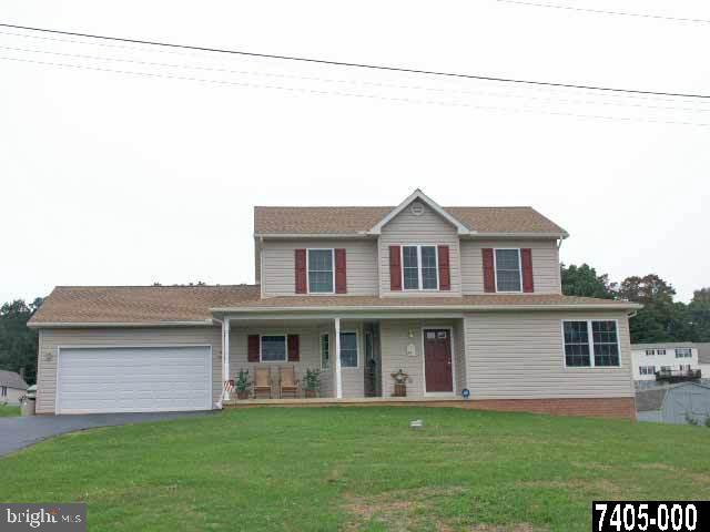 16 Myers Road, Unit 16 Spring Grove, PA 17362 - Photo 1 of 1 a front view of a house with a garden and yard