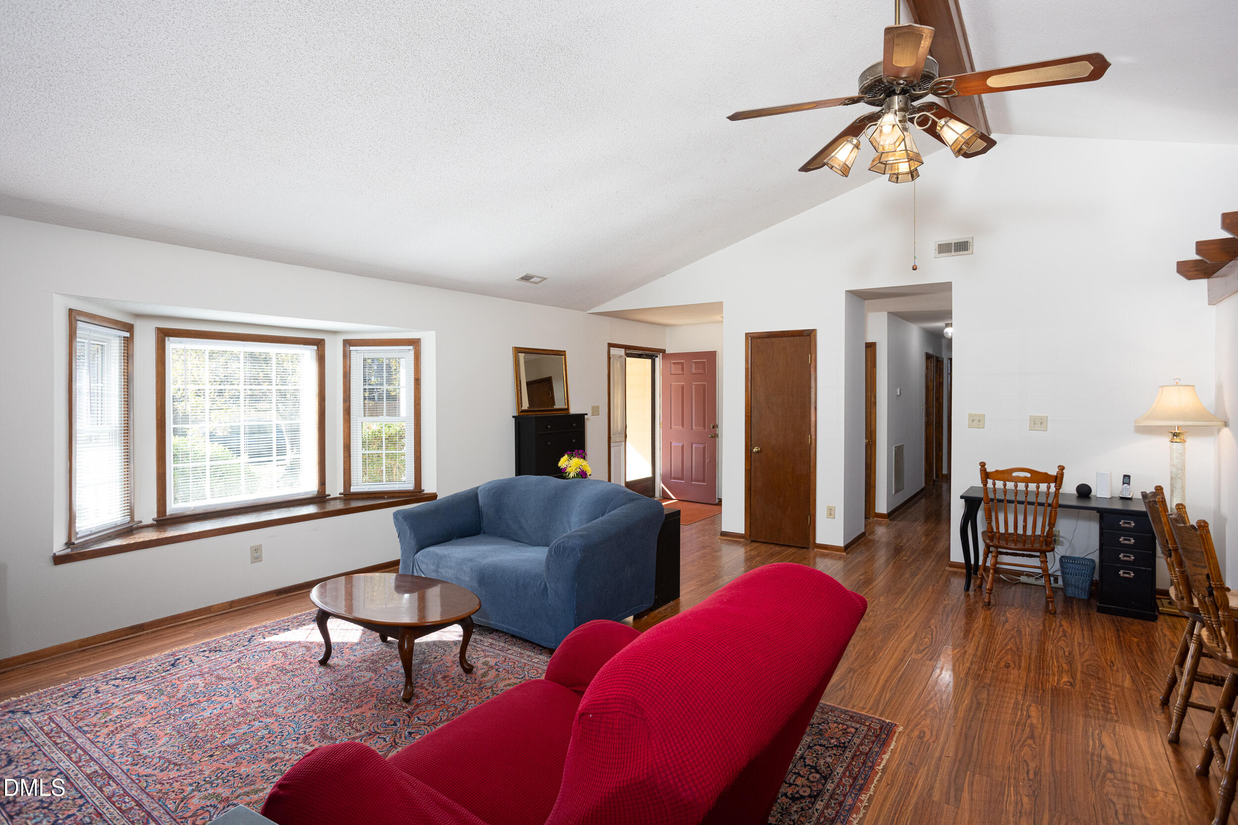 5520 Round Hill Lane Raleigh, NC 27616 - Photo 14 of 29 a living room with furniture a dining table and a window