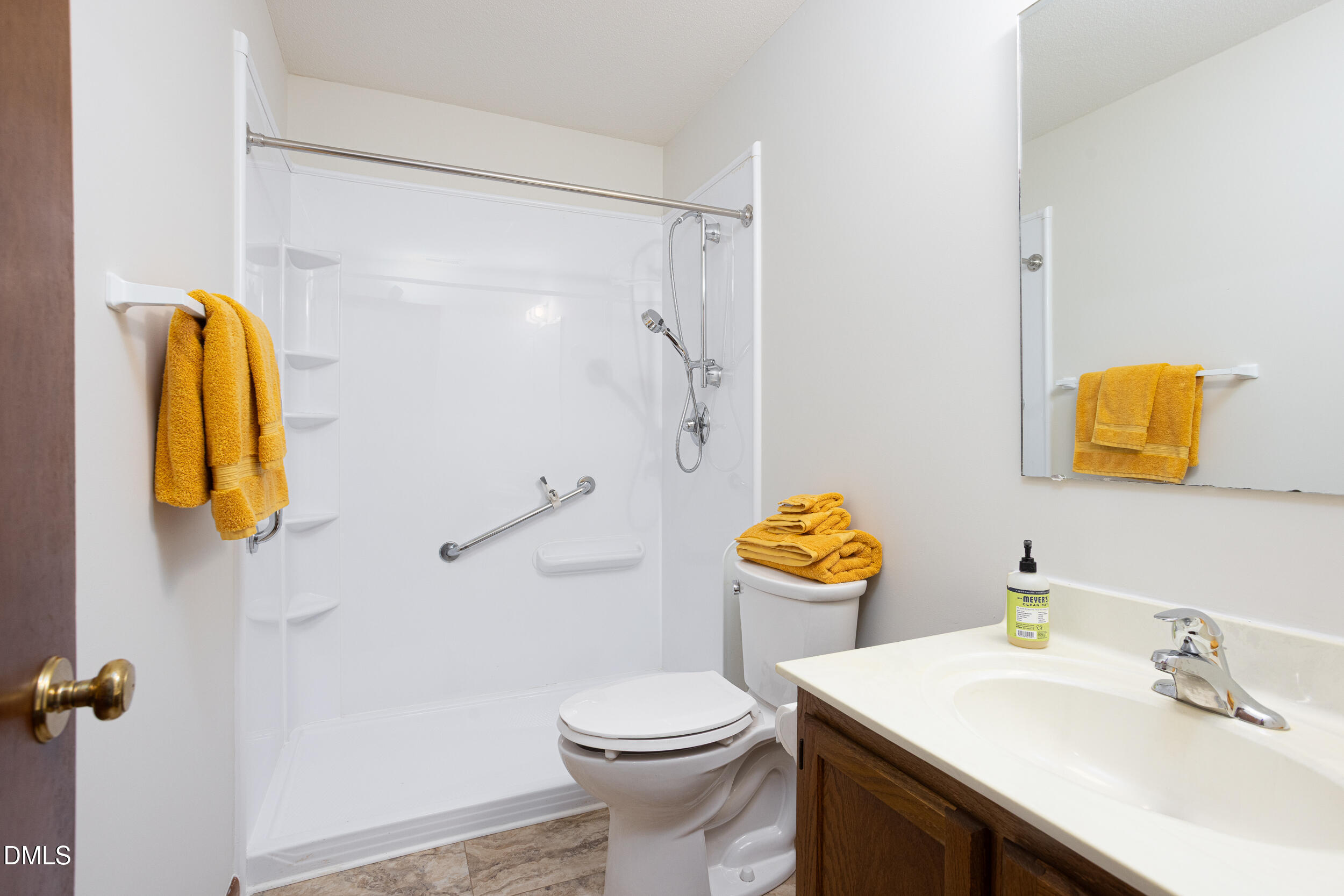 5520 Round Hill Lane Raleigh, NC 27616 - Photo 18 of 29 a bathroom with a sink vanity mirror and toilet