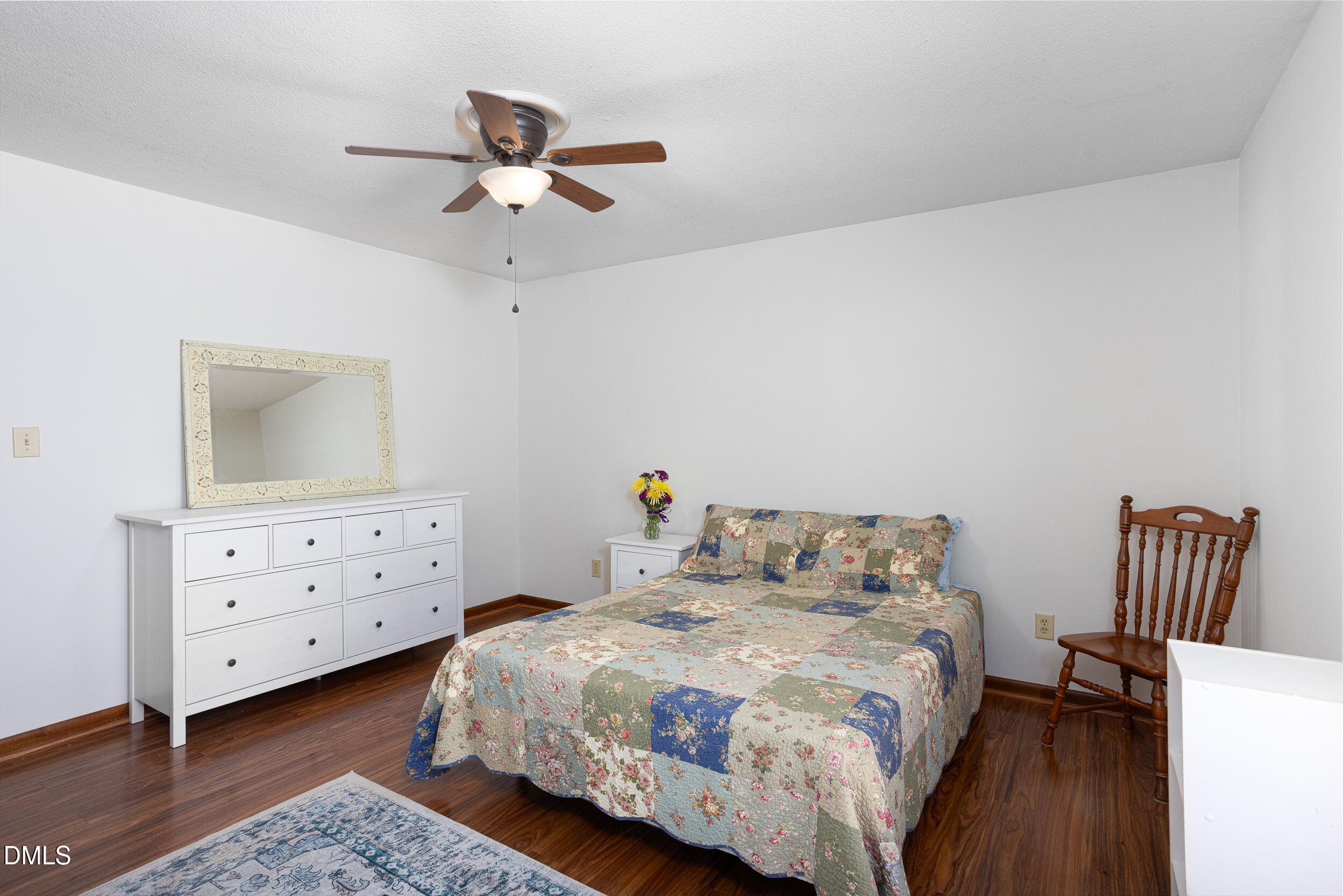5520 Round Hill Lane Raleigh, NC 27616 - Photo 21 of 29 a bedroom with a bed and a dresser in it