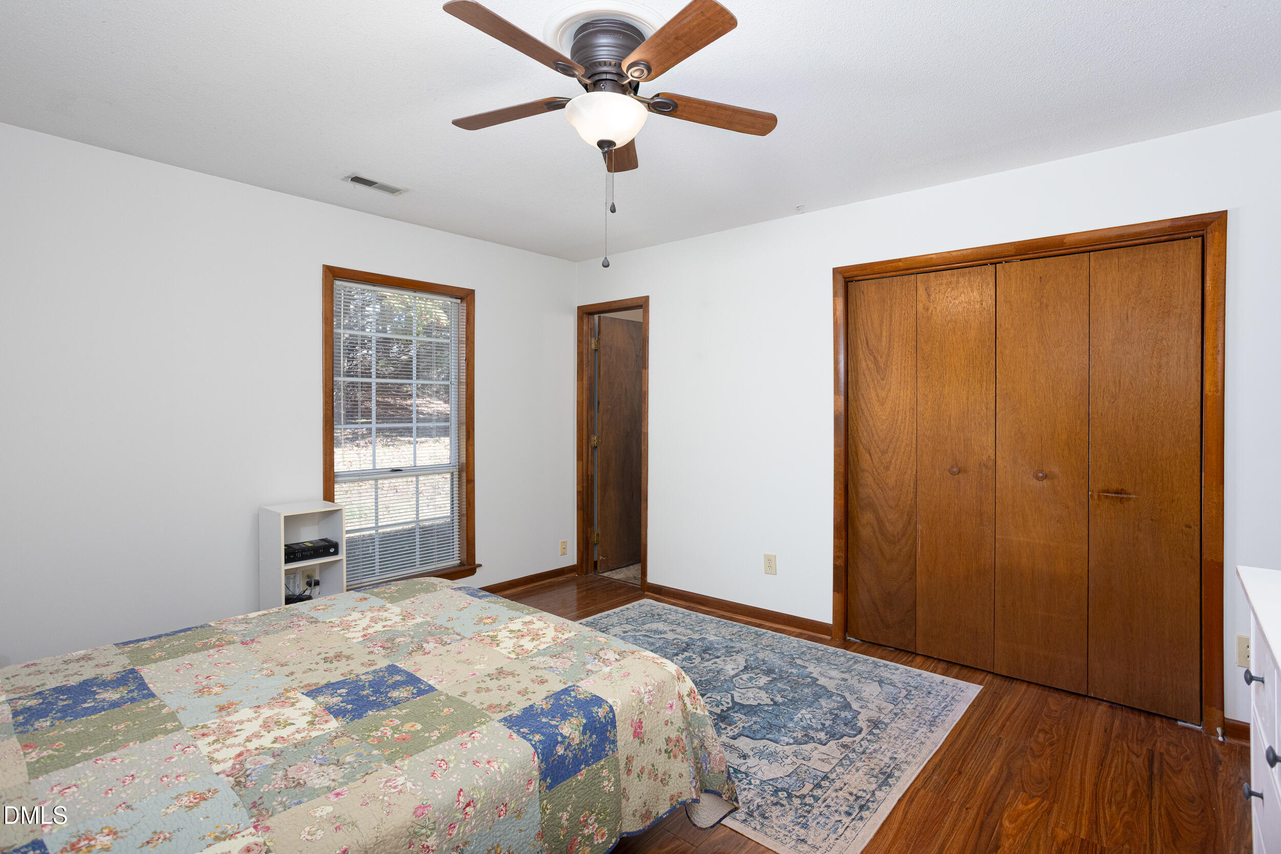 5520 Round Hill Lane Raleigh, NC 27616 - Photo 22 of 29 a bedroom with a bed and a dresser